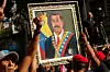 People carry a portrait of Venezuela's President Nicolas Maduro as they attend a march calling for his release, after he and his wife Cilia Flores were captured following U.S. strikes on Venezuela, in Caracas, Venezuela, on Jan. 4. [REUTERS/YONHAP]