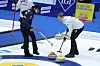 Korea's Gim Eun-ji, left, follows the stone during an LGT World Women's Curling Championship match against Canada at Uijeongbu Indoor Ice Rink in Uijeongbu, Gyeonggi on March 19. [YONHAP]