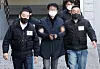 The 67-year-old who attacked Democratic Party chief Lee Jae-myung is being escorted from a police station in Busan to attend an arrest warrant hearing at the Busan District Court on Jan. 4. [NEWS1]
