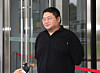Lee Jun-hee, known by his YouTube alias GooJeYeok, arrives at the Suwon District Prosecutors Office in Suwon, Gyeonggi, on July 26, 2024, to attend a court hearing to review a warrant for his arrest. [NEWS1]