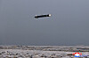 A Hwasal-2 cruise missile flies at low altitude above the western coast of North Korea on Tuesday morning in this photo released by Pyongyang's state-controlled Korean Central News Agency on Wednesday. [YONHAP]