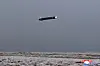 A Hwasal-2 cruise missile flies at low altitude above the western coast of North Korea on Tuesday morning in this photo released by Pyongyang's state-controlled Korean Central News Agency on Wednesday. [YONHAP]