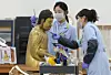 Conservators perform a dry-ceaning treatment on a wooden Buddha statue at the National Museum of Korea's new Conservation Science Center on Oct. 28, in Yongsan District, central Seoul. [NEWS1]