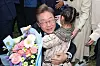 Democratic Party's presidential candidate Lee Jae-myung hugs a little child after receiving a bouquet of flowers on May 5 in Jincheon County in North Chungcheong. [NEWS1]