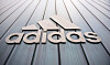 The logo of sportswear brand Adidas is pictured on an Outlet Center in Herzogenaurach, southern Germany, on Nov. 25, 2022. [AFP/YONHAP]