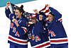 Megan Keller, Aerin Frankel and Hayley Scamurra of United States celebrate with their national flag and gold medals in ice hockey for the 2026 Winter Olympics during the ceremony at the Milano Santagiulia Ice Hockey Arena in Milan on Feb. 19. [REUTERS/YONHAP]