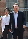 Former President Yoon Suk-yeol and his wife Kim Keon Hee arrive at the polling station at Wonmyong Elementary School in Seocho District, southern Seoul, on Tuesday morning to cast their ballots in the 21st presidential election. [JOONGANG ILBO]