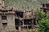 Afghan men stand on top of a damaged house following a deadly magnitude 6 earthquake that struck Afghanistan on Sunday, in Mazar Dara, Kunar province, Afghanistan, Sept. 2. [REUTERS/YONHAP]