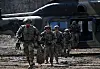 South Korean and U.S. troops disembark from a Surion military transport helicopter to head to a target area at a training ground in the South Korean border city of Paju on March 11, as part of an airborne infiltration drill. [JOINT PRESS CORPS]
