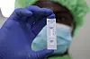 A worker displays a plastic test cassette for HIV 1/2 at Codix Bio production plant where HIV and Malaria test kits are locally produced, as it aims to fill the gap left by U.S. funding cuts to USAID, in Iperu-Remo in Ogun State, Nigeria on June 18. [REUTERS/YONHAP]
