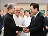 President Lee Jae Myung greets Bishop Mathias Ri Iong-hoon, head of the Korean Catholic Bishops' Conference, left, during a luncheon with religious leaders at the presidential office in Yongsan, central Seoul, on July 9. [JOINT PRESS CORPS]