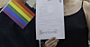 A same-sex couple in their 30s holds a certificate of non-acceptance for their marriage registration. [JEONBUK PEACE AND HUMAN RIGHTS COALITION]