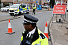 Police officers work at the entrance to an electrical substation in London on March 22. [REUTERS/YONHAP]