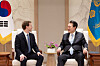 President Yoon Suk Yeol, right, chats with Mark Zuckerberg, the chief executive of Meta, at the Yongsan presidential office in central Seoul on Thursday. [PRESIDENTIAL OFFICE]