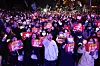 People participating in a candlelight march chant slogans urging the passage of the impeachment motion against President Yoon Suk Yeol on Saturday in front of the National Assembly in western Seoul. [YONHAP]