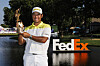 Hideki Matsuyama of Japan poses with the trophy on the 18th green after winning the FedEx St. Jude Championship at TPC Southwind on Sunday in Memphis, Tennessee. [GETTY IMAGES]