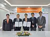 Jung Seung-kyun, center, vice president of Hanwha Ocean, and Hong Chung-sik, second from left, area commercial manager for North East Asia at Lloyd's Register, pose for a photo at a signing ceremony in Busan on May 30, in this photo provided by Hanwha Ocean. [YONHAP]