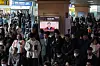 Citizens watch the live broadcast of the Constitutional Court's impeachment trial verdict in the waiting room of Seoul Station in Yongsan District, central Seoul, on April 4. [NEWS1]