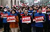 Lawmakers from the liberal Democratic Party lead a march calling for President Yoon Suk Yeol's removal from office in front of Gwanghwamun Gate in Jongno District, central Seoul, on March 12. [YONHAP]