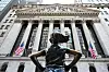 An exterior view of the New York Stock Exchange and the ″Fearless Girl″ statue in the Financial District of New York City on April 8, 2025. [AFP/YONHAP]