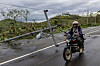 A motorist rides past a fallen post in the aftermath of Typhoon Fung-wong in Cordon, Isabela, Philippines on Nov. 10. [REUTERS/YONHAP]
