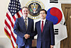 This photo, released by South Korea's Industry Ministry, shows Trade Minister Yeo Han-koo, right, shaking hands with U.S. Trade Representative Jamieson Greer before their talks in Washington on July 25. [MINISTRY OF TRADE, INDUSTRY AND ENERGY]