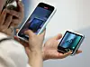 A customer takes a photo of the Galaxy Z Flip 6 at Samsung Electronics' retail shop in western Seoul on Thursday. [YONHAP]