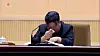 North Korean leader Kim Jong-un wipes his tears during the National Meeting of Mothers in Pyongyang on Sunday, according to footage released by the North Korean state-run Korean Central TV. [YONHAP]