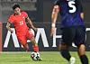 Korea's Ji So-yun, left, dribbles during an EAFF E-1 Women's Football Championship match against Japan at Hwaseong Sports Complex in Hwaseong, Gyeonggi on July 13. [YONHAP]