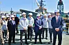 U.S. Secretary of the Navy John Phelan, fifth from right, and HD Hyundai Executive Vice Chairman Chung Ki-sun, next to Phelan, look at special vessels at HD Hyundai Heavy Industries' shipyard in Ulsan. [HD HYUNDAI HEAVY INDUSTRIES]