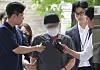 A 69-year-old driver surnamed Cha, who drove a vehicle into a sidewalk near Seoul City Hall on July 1, 2024, killing nine people, walks into Seoul Central District Court in Seocho District, western Seoul, on Feb. 12. [NEWS1]