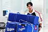 Kim Hye-seong of the Los Angeles Dodgers arrives at Incheon International Airport carrying Dodgers duffle bags on Nov. 6, 2025. [YONHAP]