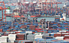 Containers are stacked up at a port in Busan on March 7. [NEWS1]