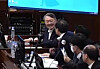 Former President Yoon Suk Yeol, who has been indicted on charges of leading an insurrection, smiles while speaking with his attorneys during a sentencing hearing held Jan. 13 at the Seoul Central District Court in Seocho District, southern Seoul. [SEOUL CENTRAL DISTRICT COURT]