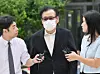 Jeon Seong-bae, known as Geon Jin Beopsa, arrives at the special counsel’s office in central Seoul on Aug. 18. [JOONGANG ILBO]
