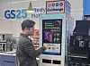 A customer uses the currency exchange kiosk at a GS25 store. [GS RETAIL]