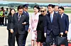 President Lee Jae Myung, left, and first lady Kim Hea Kyung, second from left, are greeted by U.S. officials as they arrive at Joint Base Andrews in Maryland on Aug. 24 from Tokyo to begin a three-day trip to the United States for a bilateral summit with U.S. President Donald Trump. [JOINT PRESS CORPS]