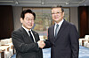 Korean President Lee Jae Myung, left shakes hands with Chen Jining, the Shanghai Municipal Party secretary, ahead of a welcome dinner hosted by Chen in Shanghai on Jan. 6. [JOINT PRESS CORPS]