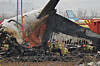 Firefighters conduct search operations at the wreckage site of the Jeju Air aircraft at Muan International Airport in Muan, South Jeolla on Dec. 30, 2024. [EPA/YONHAP]