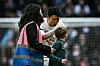 Tottenham Hotspur's Son Heung-min greets a young pitch invader and the end of a Premier League match against Luton Town at Tottenham Hotspur Stadium in London on Saturday. [AFP/YONHAP]