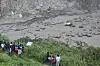 People watch the damage caused by flooding on the Bhotekoshi River 75 miles north of Kathmandu, Nepal, July 8. [AP/YONHAP]