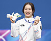 Choi Min-jeong of Korea celebrates on the podium after winning the silver medal in the women's 1,500-meter short track speed skating event at the 2026 Winter Olympics at Milano Ice Skating Arena in Milan on Feb. 20. [YONHAP]