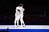 Oh Sang-uk and Gu Bon-gil embrace after Oh beating reigning champion Gu in the men's individual sabre finals at the Asian games at Hangzhou Dianzi University Gymnasium in Hangzhou, China on Monday. [NEWS1]