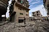 A Palestinian boy stands amid the rubble of a building destroyed in an Israeli strike at the Bureij refugee camp in the central Gaza Strip, Palestine, on April 27. [AFP/YONHAP]