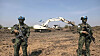 Two soldiers of the Hanbit Unit stand guard at a construction site in South Sudan on Feb. 12. [JOINT CHIEFS OF STAFF]