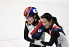 Choi Min-jeong of South Korea, left, celebrates with teammate Kim Gil-li after winning the gold medal in the women's 3,000-meter relay in short track speed skating at the Winter Olympics at the Milano Ice Skating Arena in Milan on Feb. 18.  [YONHAP]