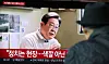 Citizens watch a video of former Democratic Party leader Lee Jae-myung announcing his run for the 21st presidential elections through a television screen at Seoul Station in Jung District, central Seoul, on April 10. [NEWS1]