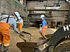 Workers carry out restoration work at the rolling mill of Pohang Steelworks, which was severely damaged by Typhoon Hinnamnor in 2022. [YONHAP]