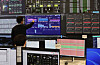 Nextrade employees inspect electronic screens inside the alternative trading system operator's control room in western Seoul on Feb. 13. [NEWS1]