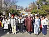 Kil Ki-yon, CEO and president of Seoul Tourism Organization, front row, third from right, Lee Soo-taek, executive director of tourism industry division at Seoul Tourism Organization, second from right, Cho Tae-sook, president of Seoul Tourism Association, fourth from right, and participants of the 2025 Seoul Eco Hiking Festa embark on a hike on Mount Namsan in Jung District, central Seoul, on Nov. 15. [PARK SANG-MOON]
